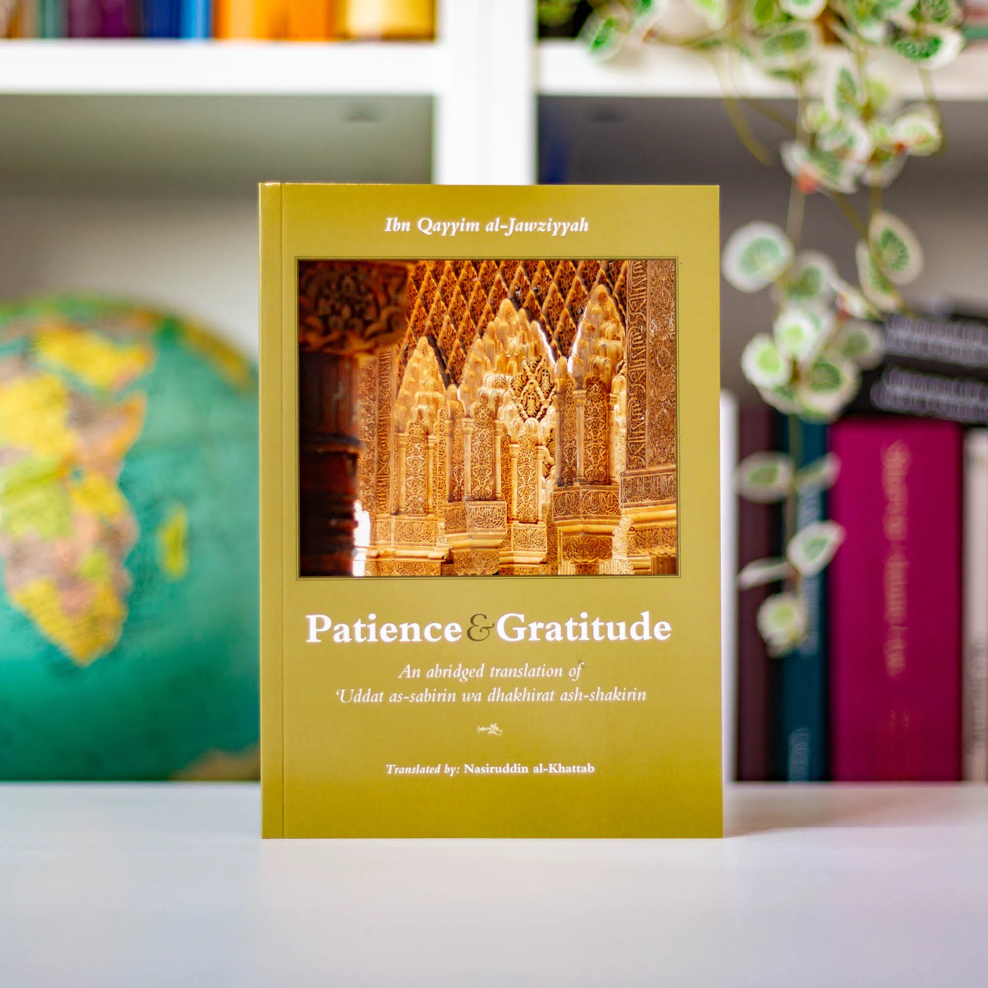 Upright book in library of Patience and Gratitude by al-Jawziyyah, Nasiruddin al-Khattab. Islamic classic on sabr and shukr by Ta-Ha Publishers
