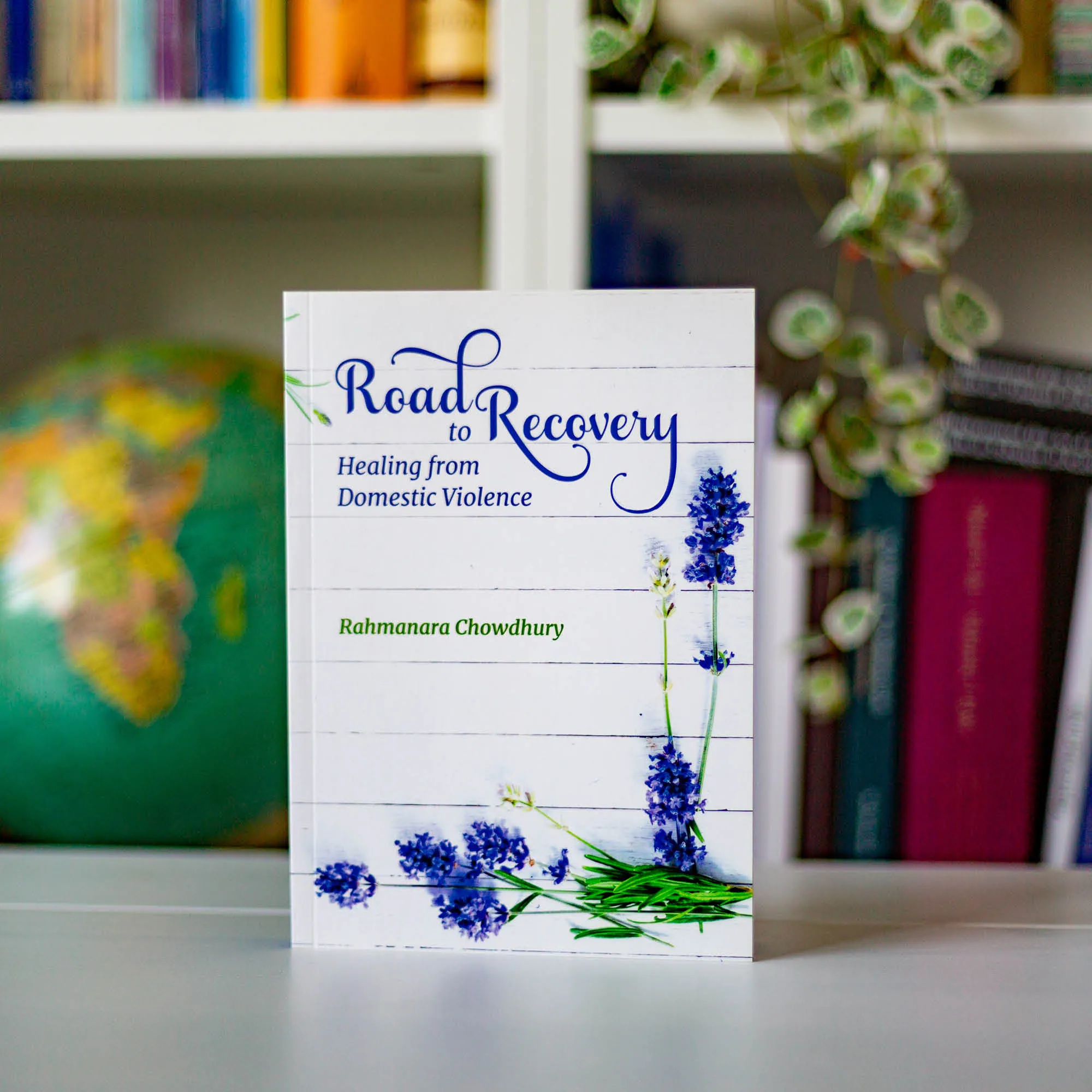 Upright book in library of Road to Recovery by Rahmanara Chowdhury. Domestic abuse guide for Muslim women by Ta-Ha Publishers