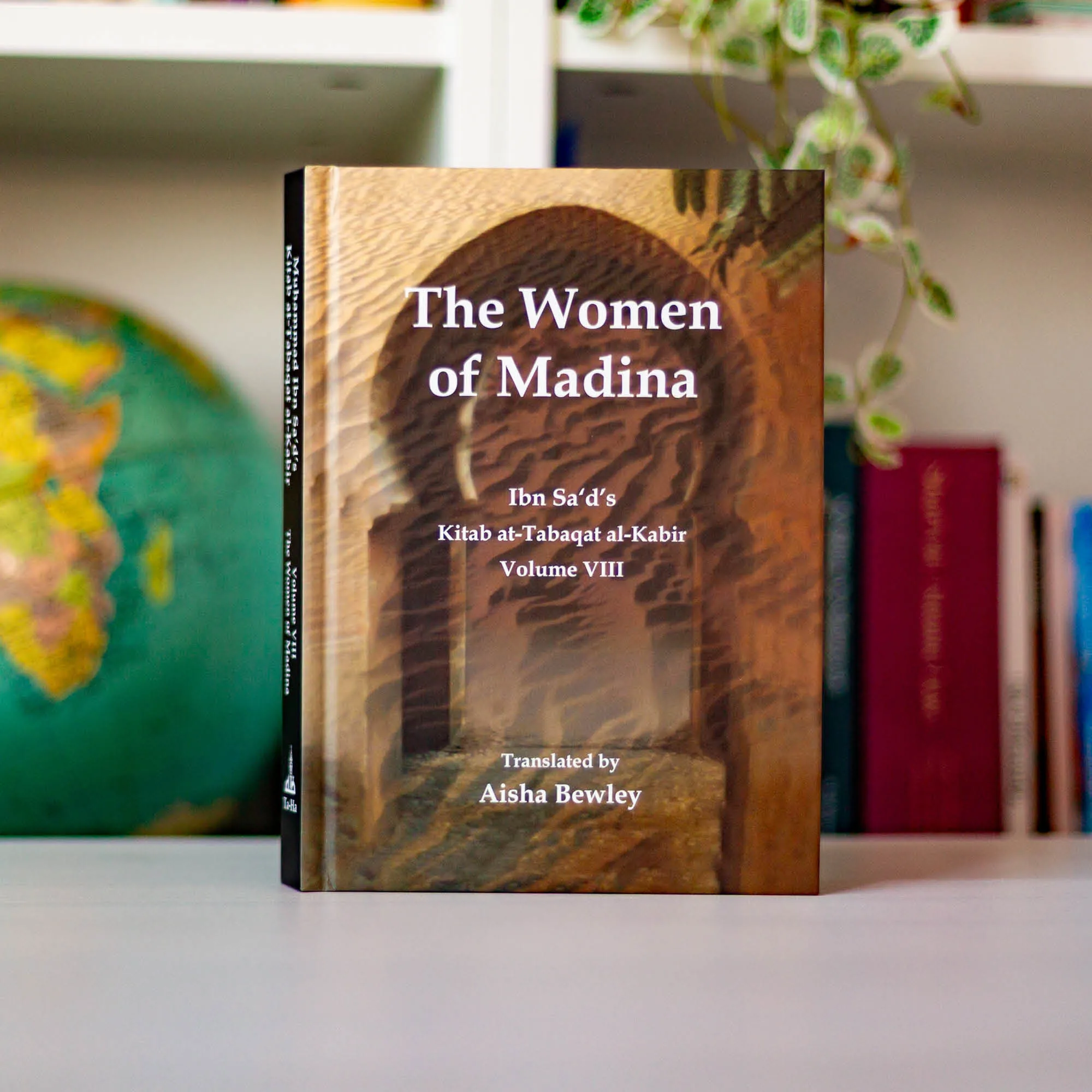 Upright book in library of The Women of Madina by Muhammad Ibn Sa’d, Aisha Bewley. Kitab at-Tabaqat by Ta-Ha Publishers