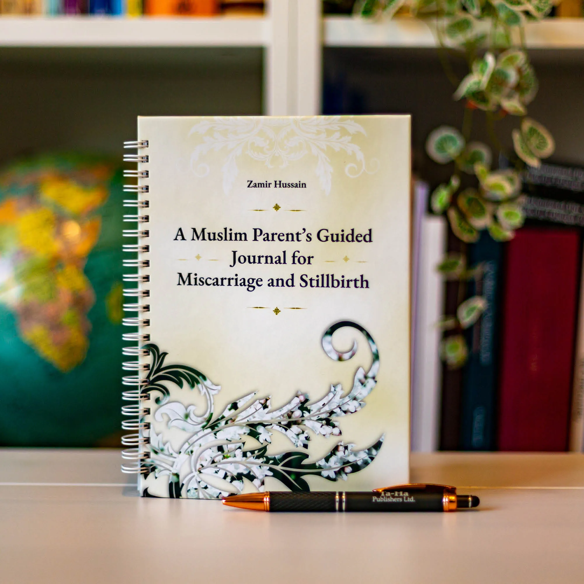 Upright book in library of A Muslim Parent’s Guided Journal for Miscarriage and Stillbirth by Zamir Hussain. Miscarriage stillbirth Islamic journal by Ta-Ha Publishers