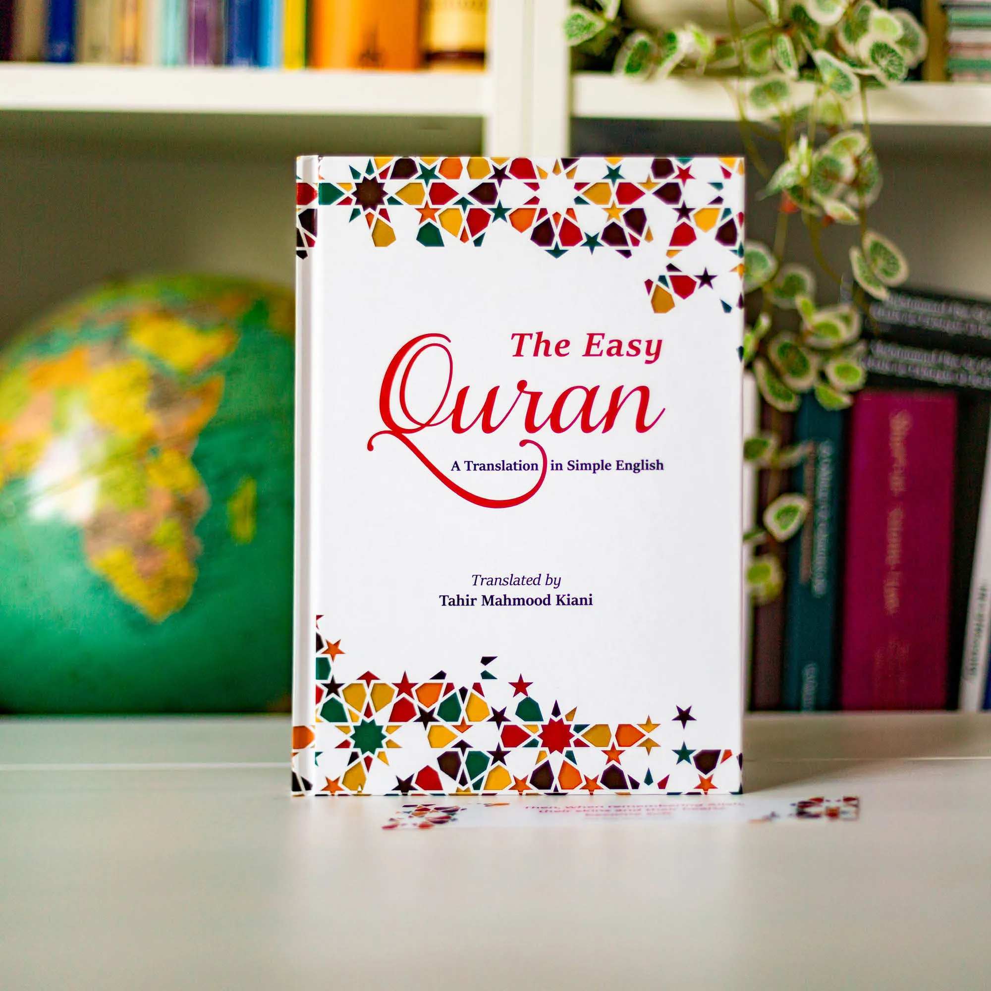 Upright book in library of The Easy Quran by Tahir Mahmood Kiani. Children’s English Quran translation by Ta-Ha Publishers.