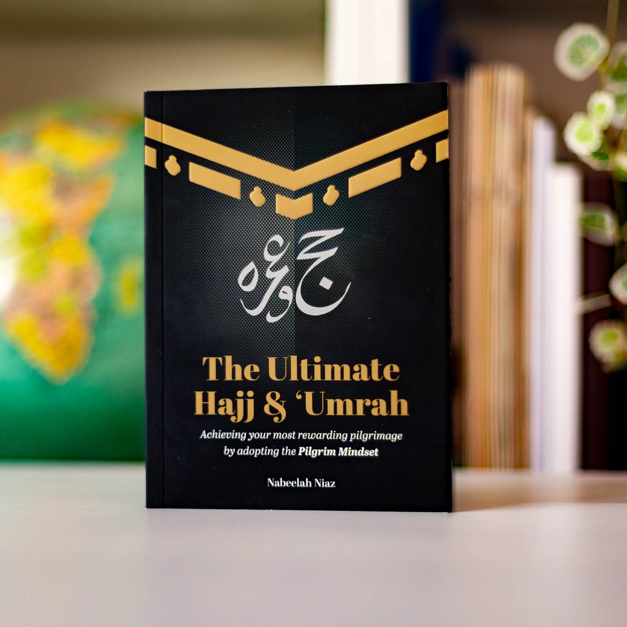 Upright book in library of The Ultimate Hajj & ‘Umrah by Nabeelah Niaz. Mindful pilgrimage handbook by Ta-Ha Publishers